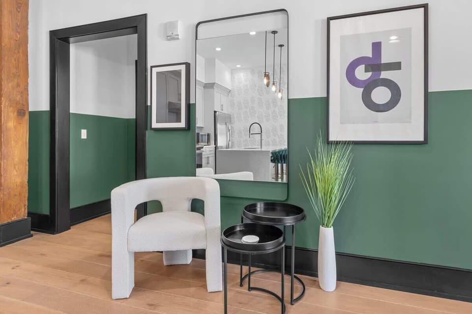 Relax in the living area with a smart TV, stylish seating, and a queen-size sleeper sofa for extra guests. Perfect for families or group stays in New Orleans, this inviting space is ideal for movie nights or recharging after a day in the city.