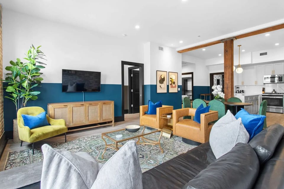 Relax in the living area with a smart TV, stylish seating, and a sleeper sofa for extra guests. Perfect for families or group stays in New Orleans, this inviting space is ideal for movie nights or recharging after a day in the city.