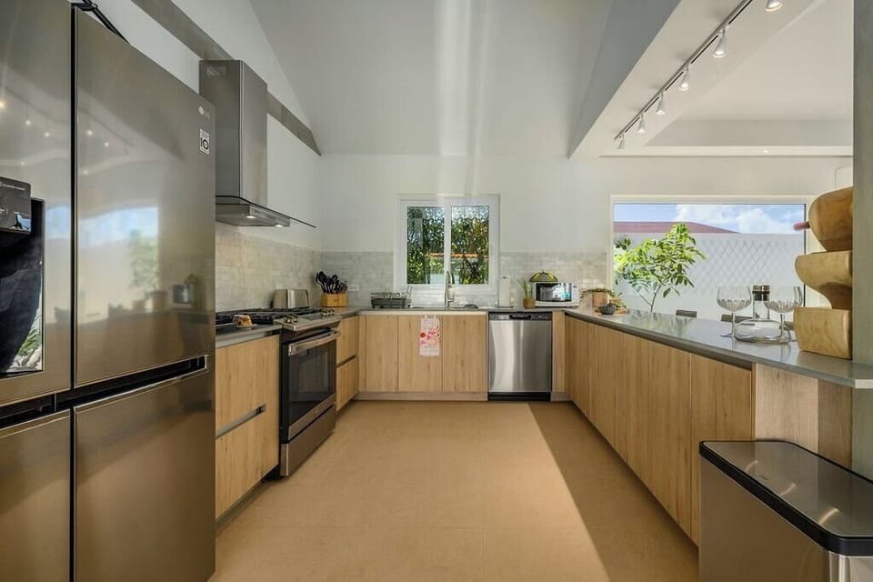 Kitchen 
Unlock culinary creativity in our fully-equipped kitchen. From gourmet meals to cozy gatherings, every dish is crafted with love in your home away from home. #CulinaryHaven