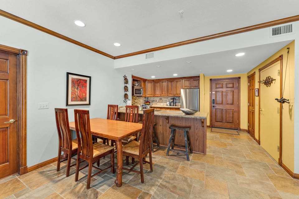 Dining Room: 5-person dining table, centrally located between kitchen and living room
