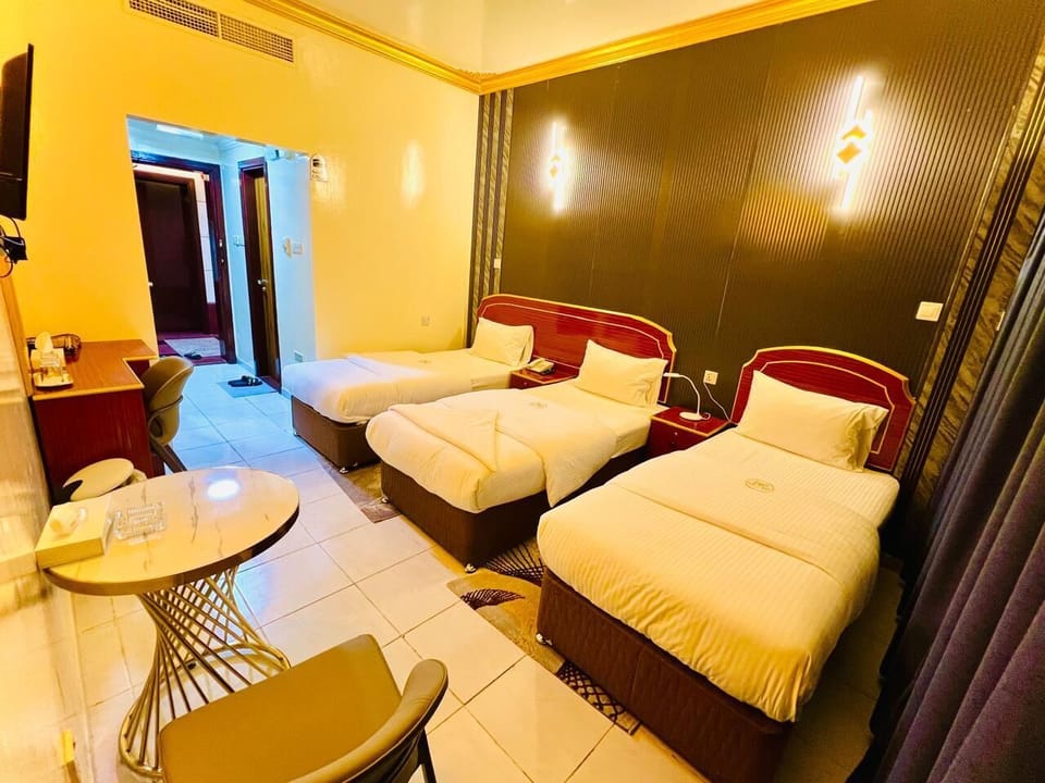 Deluxe Triple Room, City View | Soundproofing, iron/ironing board, free WiFi