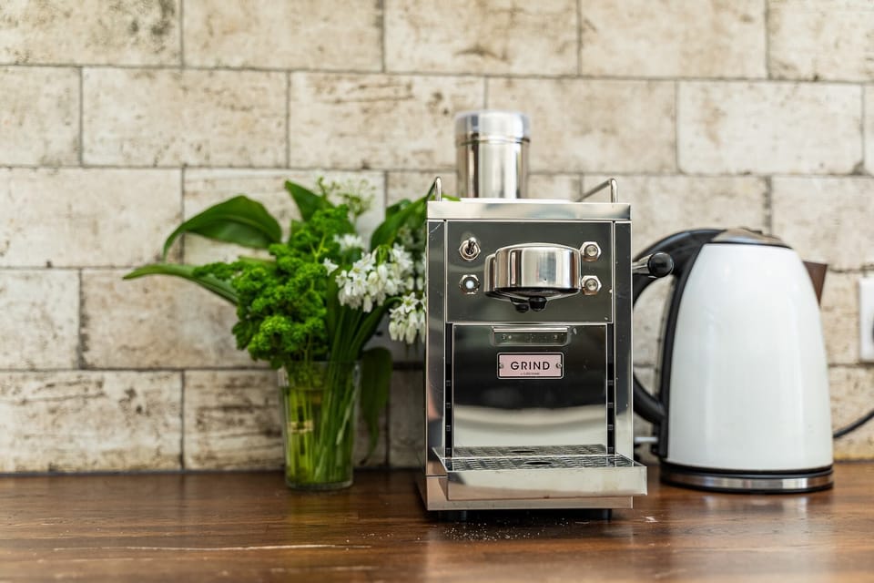 The coffee maker with coffee provided.