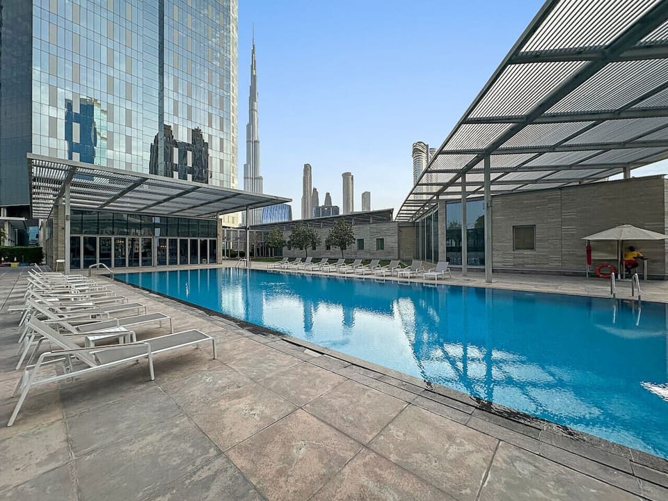 Poolside Oasis: Refresh in the shimmering pool with stunning skyline views of Dubai!