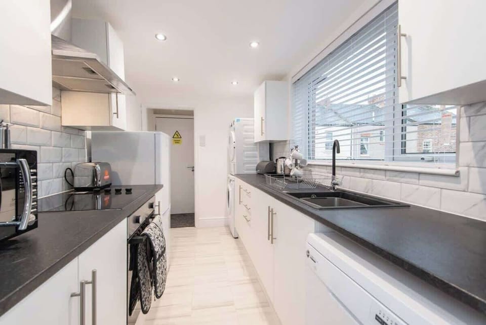 Enter our spacious kitchen, equipped with modern facilities to enhance your culinary experience.