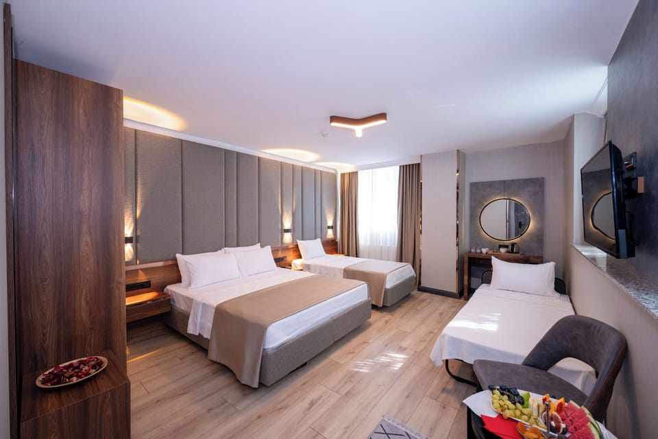 Standard Quadruple Room | Premium bedding, in-room safe, desk, laptop workspace