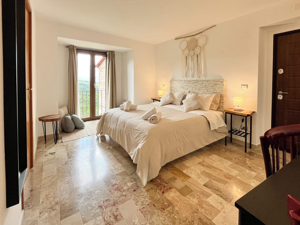 Double Room, Mountain View | Down comforters, individually decorated, individually furnished
