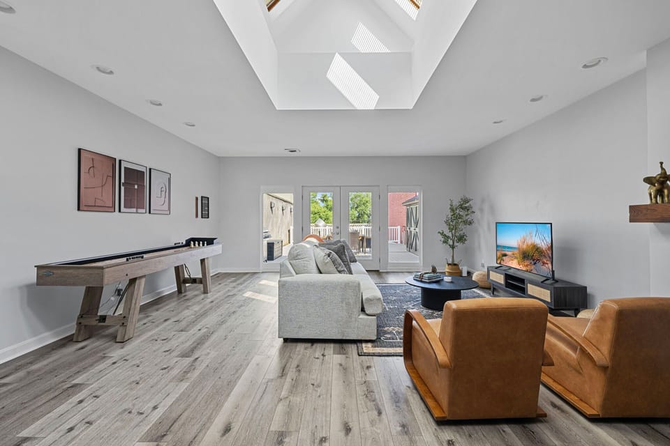 This space is all about relaxation and fun, from cozy couches to game-ready shuffleboard.