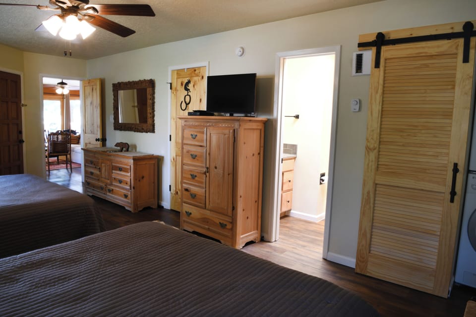 Two queen bedroom storage and TV
