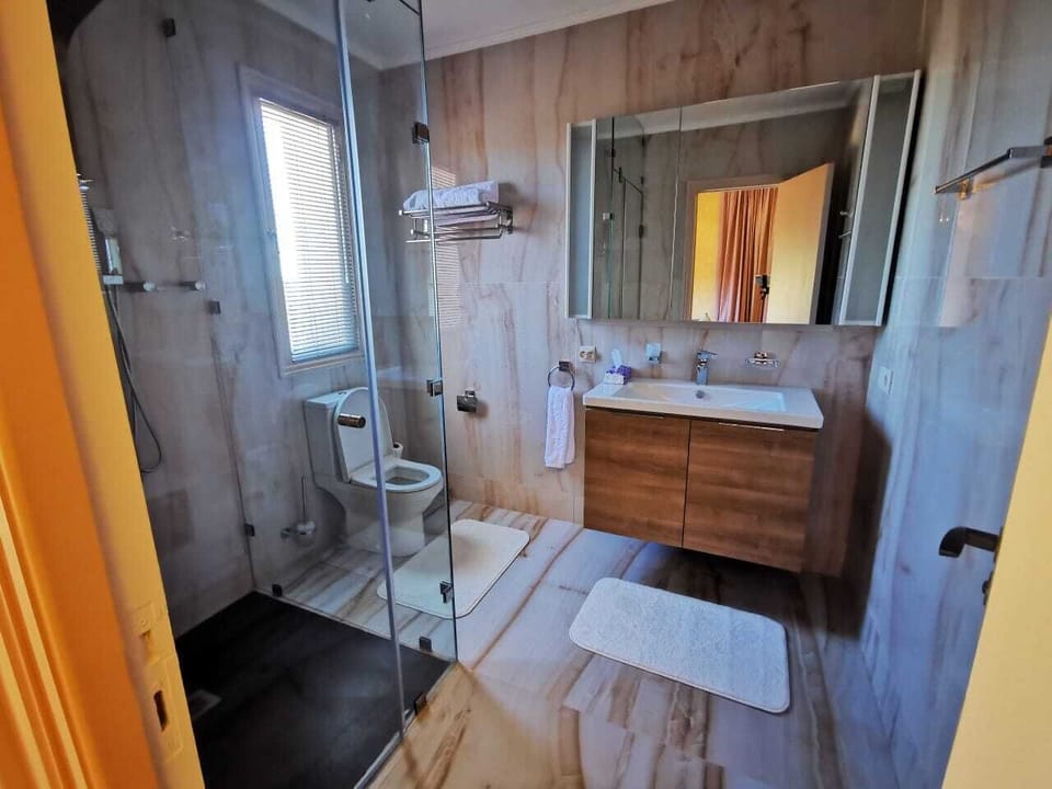 Shower, bathrobes, slippers, bidet