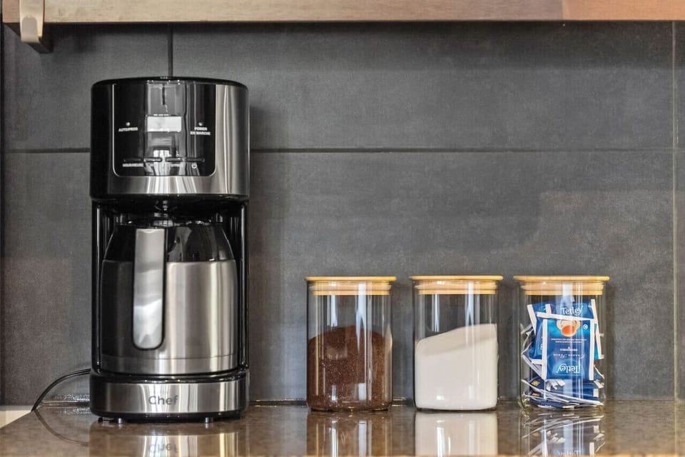 Full kitchen with a drip coffee machine, blender & crockpot/slow cooker.