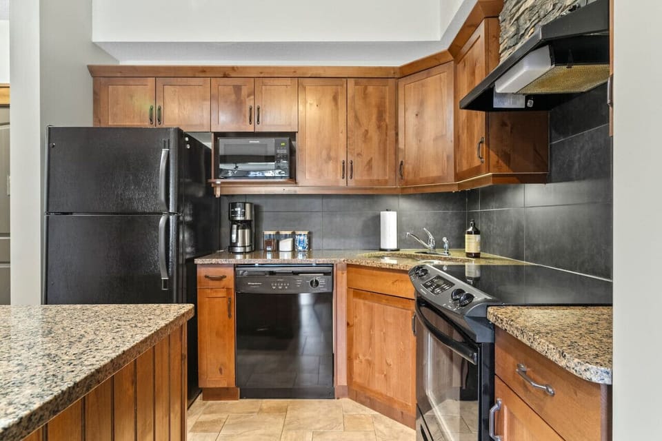 Full kitchen with a drip coffee machine, blender & crockpot/slow cooker.