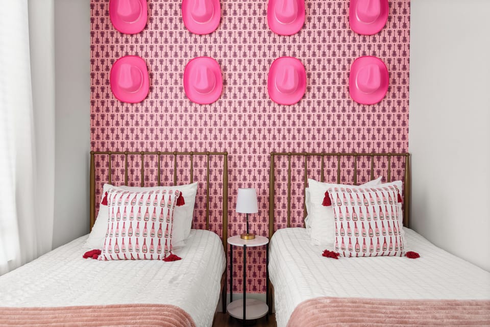 A bright, fun bedroom where bold design and comfort create the perfect stay.
