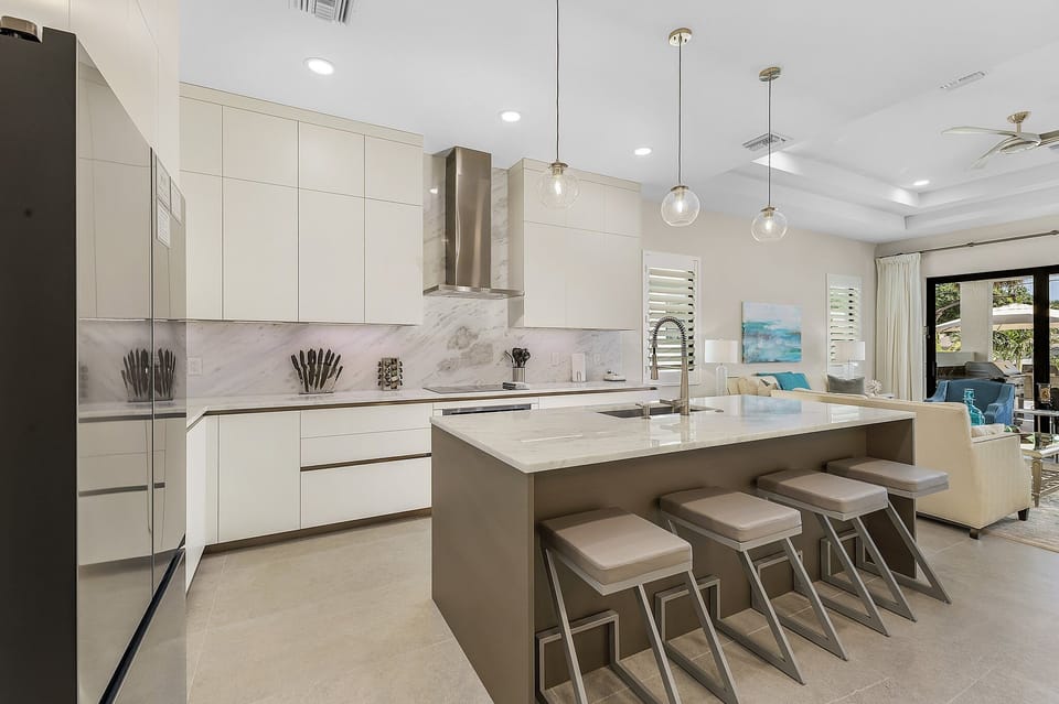 View of chef's kitchen cabinets and island.  Kitchen has all you need.