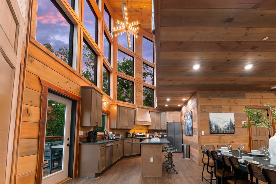 Fully equipped chef’s kitchen with granite countertops and bar seating.