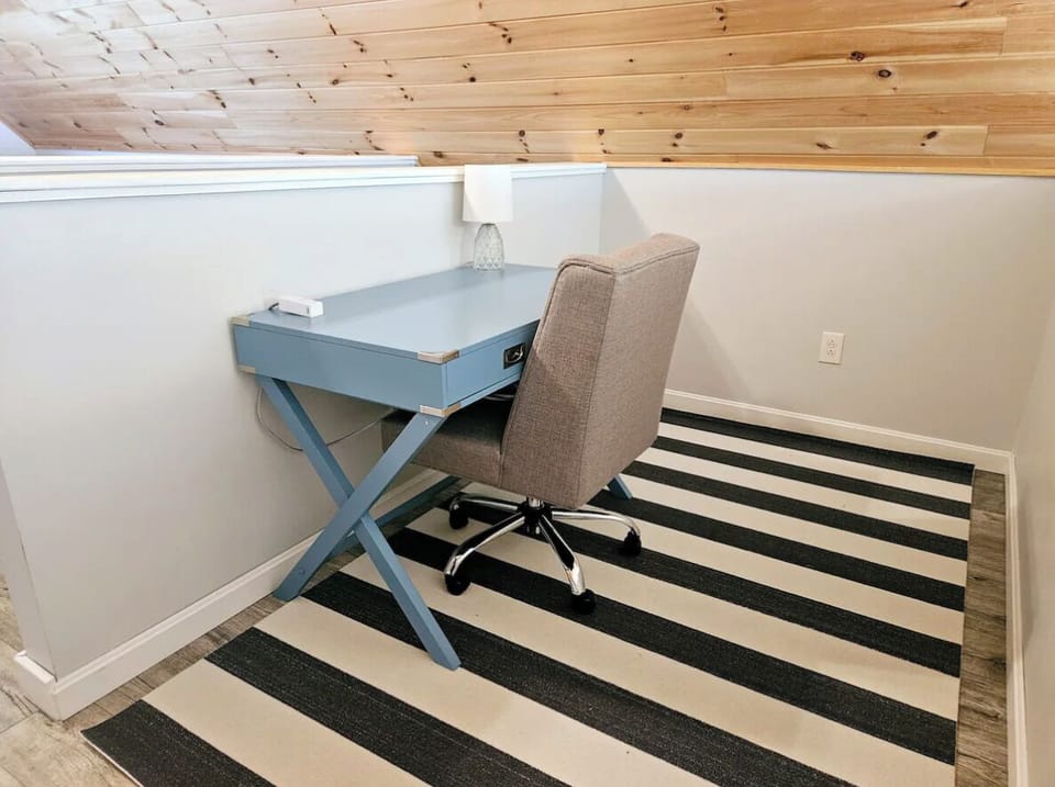Desk in the loft has a charging station with USB and USB-C ports