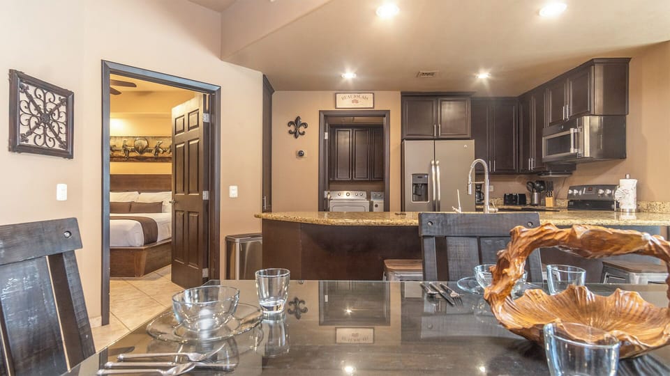 The dining table and kitchen
