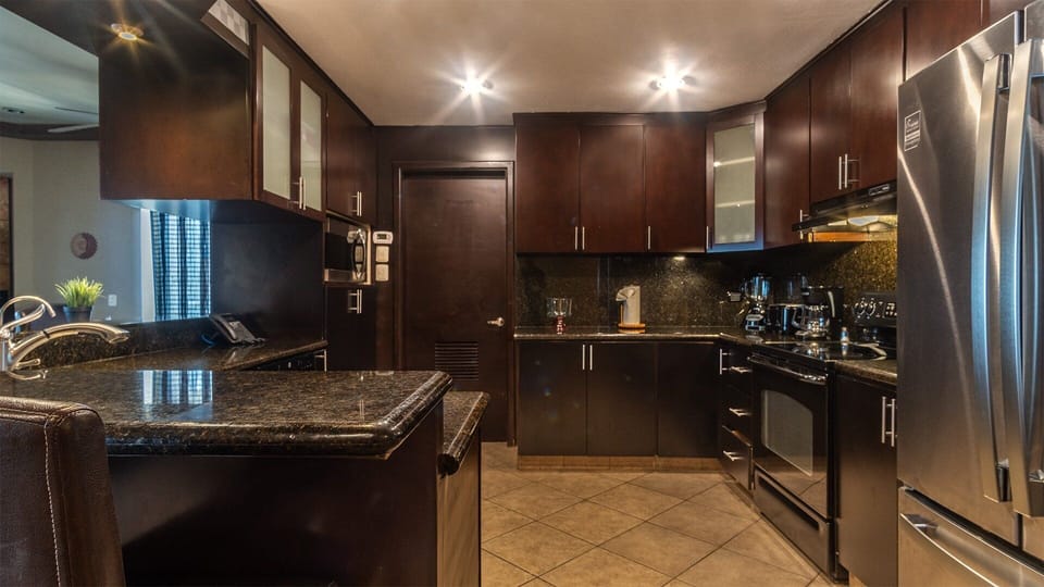 The kitchen is stylish and complete.