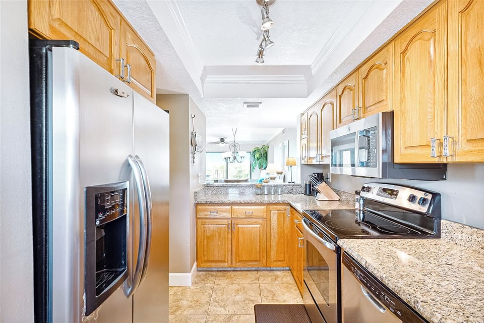 Fully equipped kitchen with modern appliances, ready for home-cooked meals.