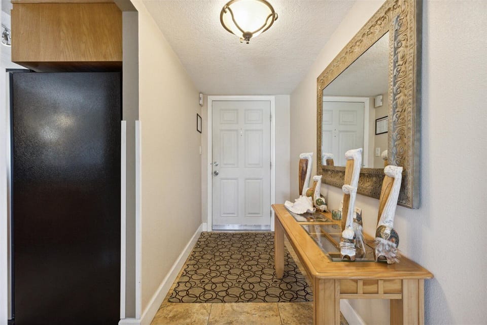 Welcoming entryway leading to a bright and spacious living area.