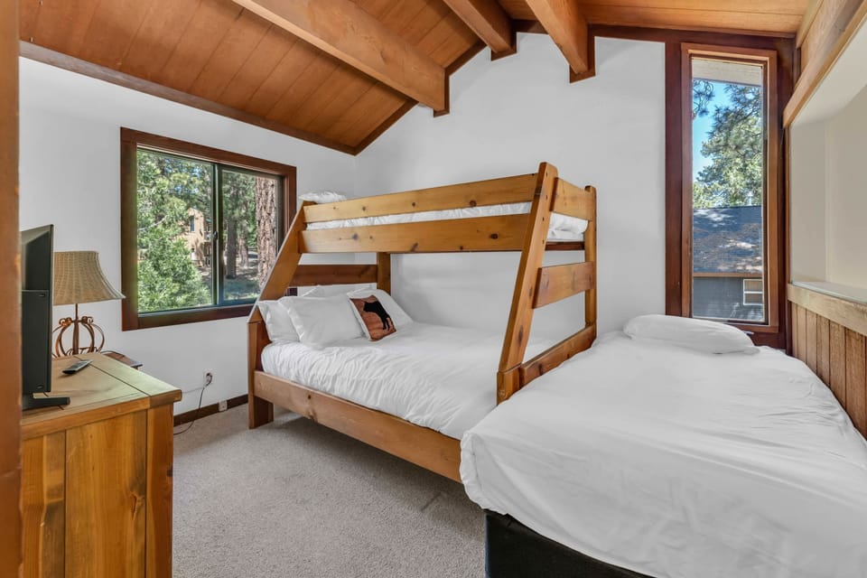 Bedroom 3: Loft-style bedroom, twin-over-twin bunk bed, full bed, 32” TV, overlooks the main living area, upper floor