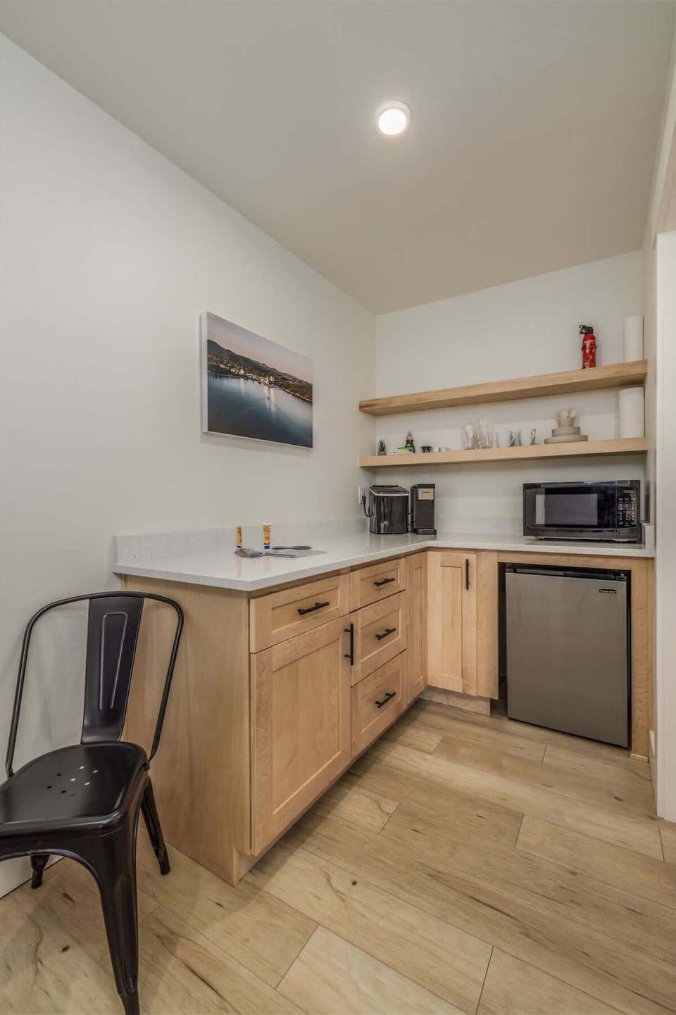 Kitchenette with large counter and storage area 