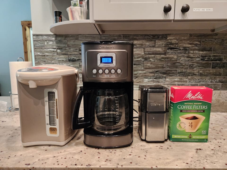 From Left to Right: Hot water pot, coffee maker, coffee grinder, filters