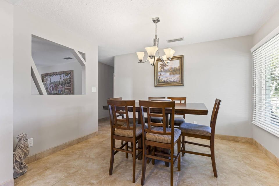 Gather 'round! This dining room table seats six and is a prime location between the kitchen and living room, perfect for entertaining & conversation.