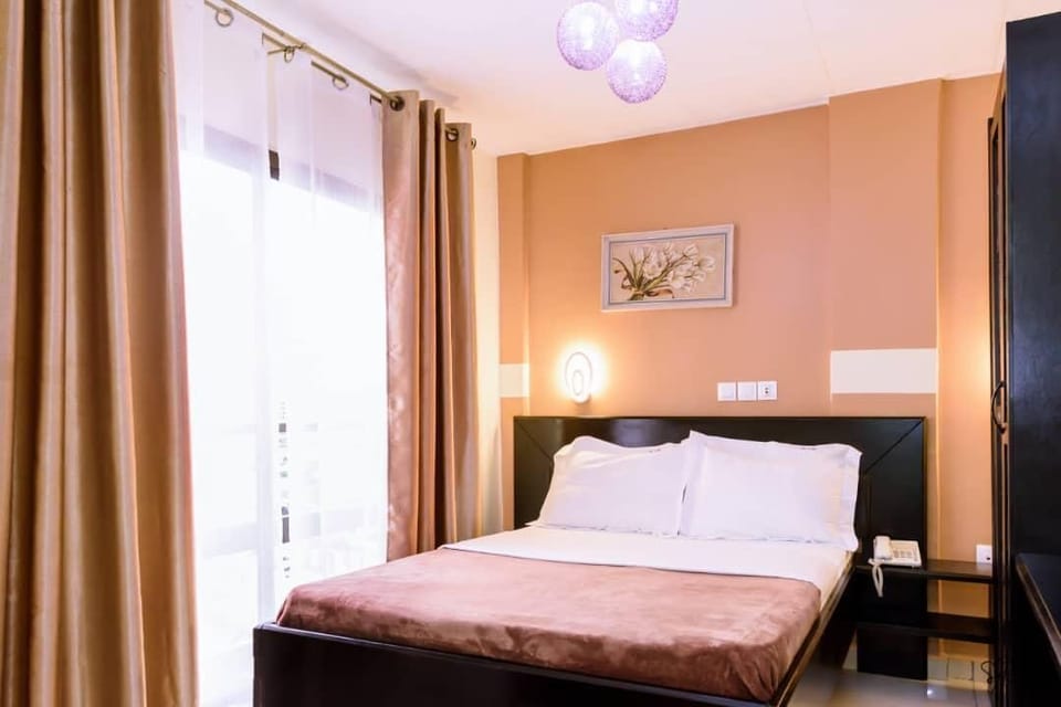 Room, City View | In-room safe, desk, blackout drapes, iron/ironing board