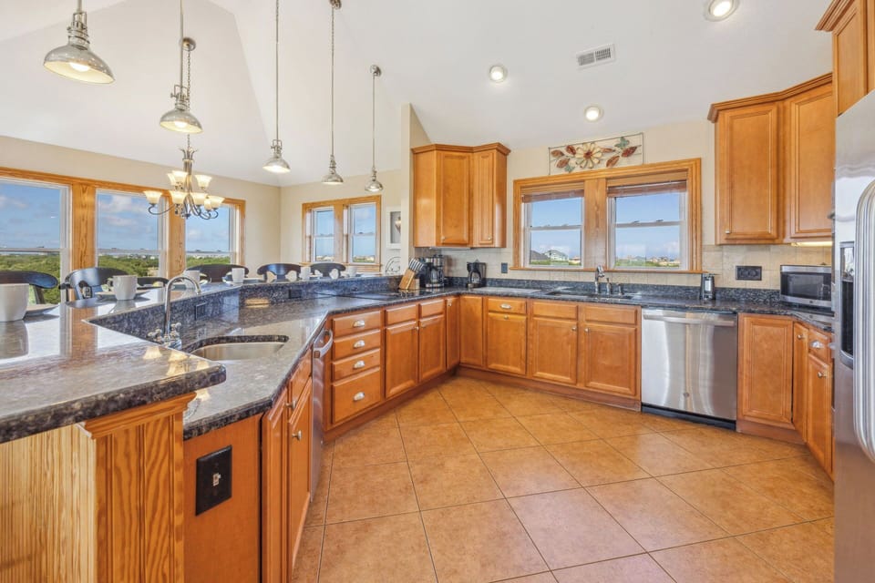 The expansive kitchen creates a joyful cooking experience with 2 dishwashers, 2 ovens, and plenty of counter space.