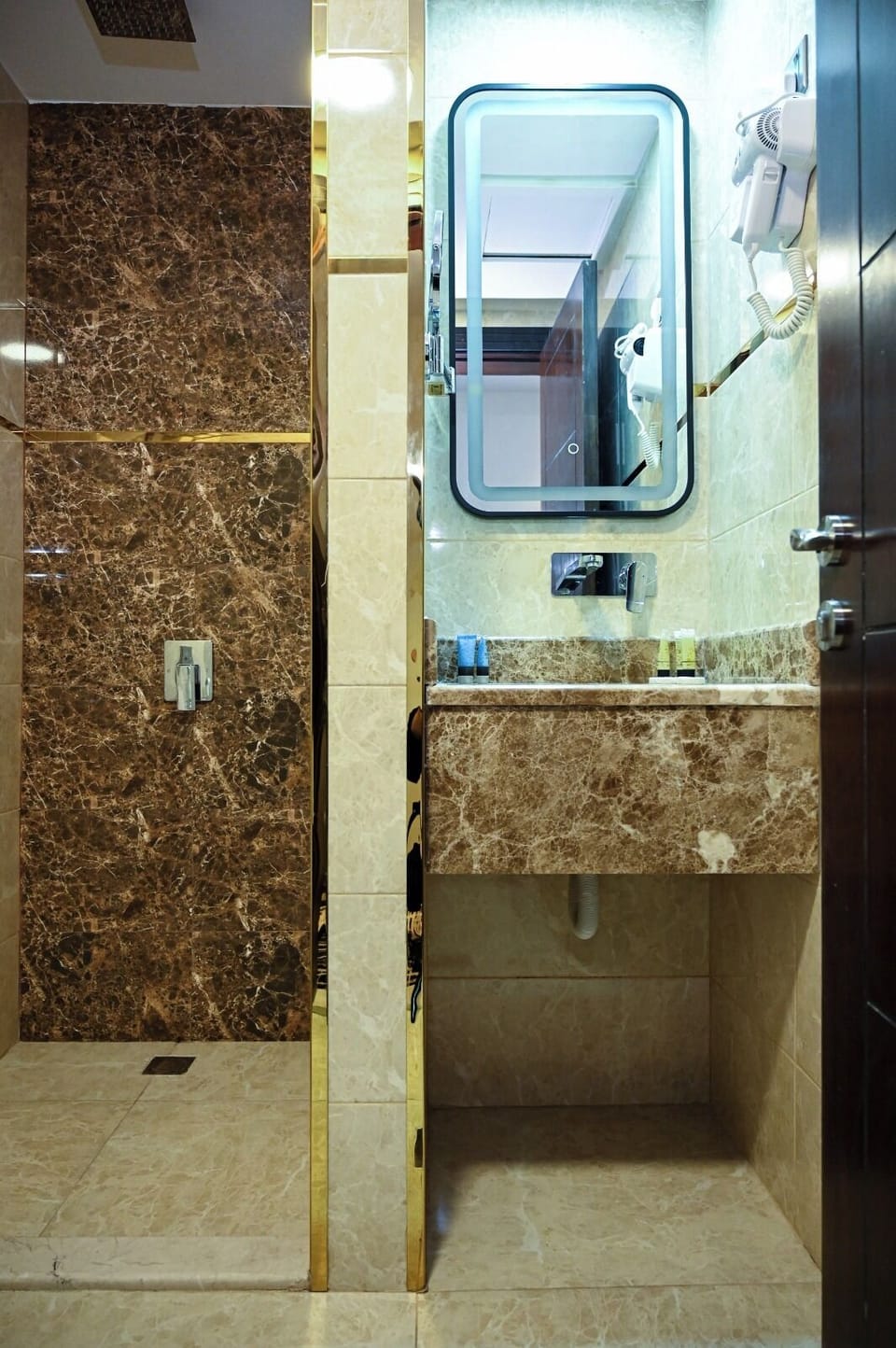 Suite, 1 King Bed | Bathroom | Hair dryer, slippers, towels, soap