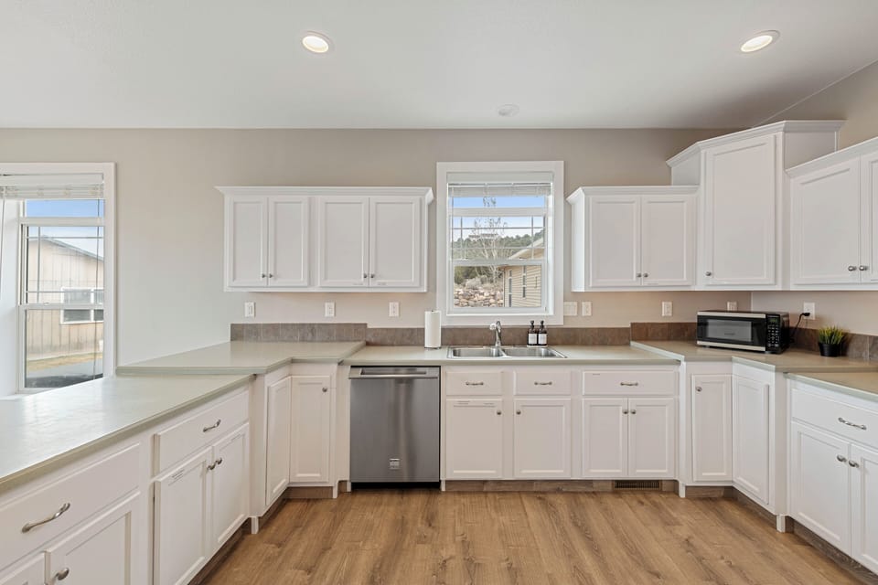 Fully stocked kitchen, with labeled drawers for easy access for cooking. 