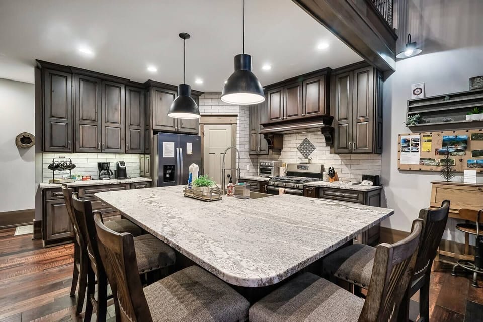 This fully equipped kitchen features a spacious island, perfect for meal prep and entertaining.