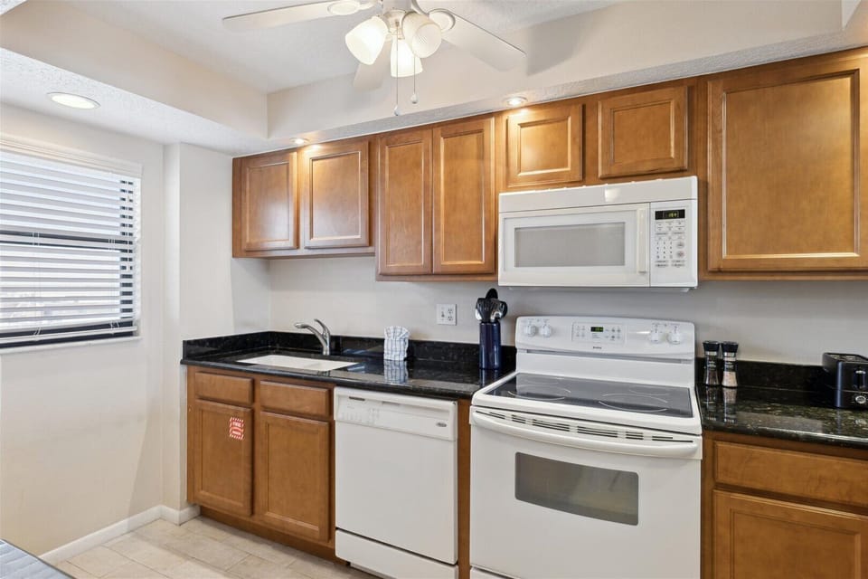 Step into a fully equipped kitchen designed to meet your basic cooking needs.