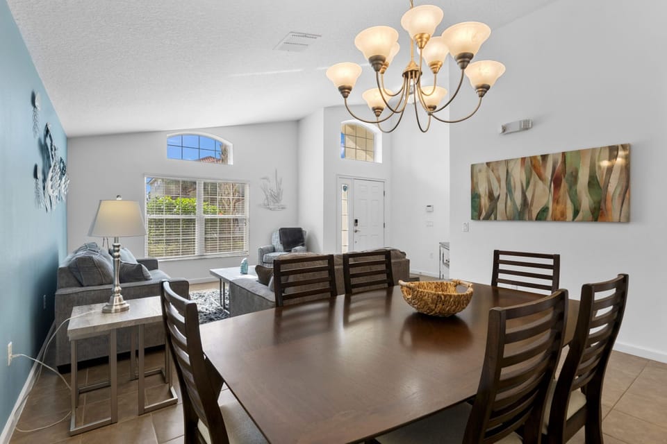 This stylish dining area, adjacent to the kitchen, provides a warm and inviting atmosphere for memorable family meals.