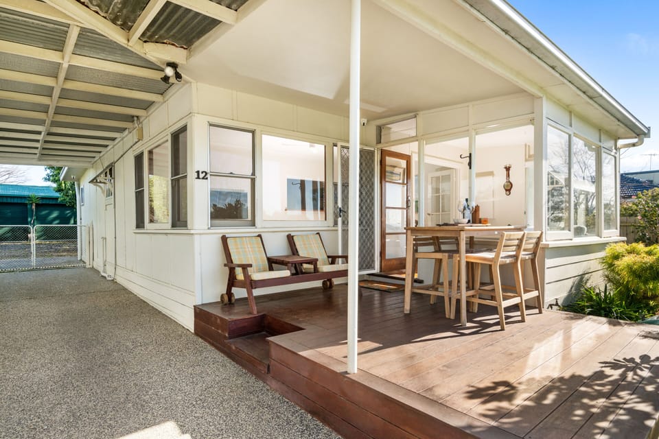 Front entrance: comfortable seating, morning sun , beach and garden views 