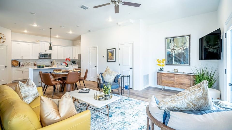 Kick back in a stylish, open-concept living space designed for comfort and connection. Whether you're debriefing after a Rangers game, watching pre-game coverage on the smart TV or just relaxing with your crew—The Ryan's living area has you covered.