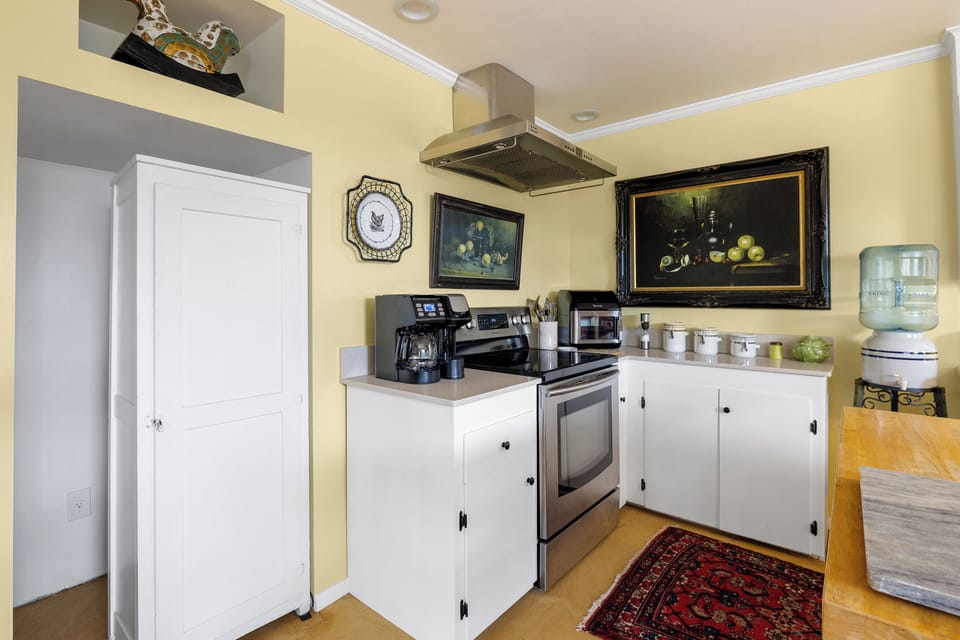Enjoy the full stove and modern amenities in this one-of-a-kind space, where contemporary convenience meets warm, inviting charm. This kitchen is thoughtfully designed to cater to all your culinary needs, creating a cozy and welcoming atmosphere for memorable meals.