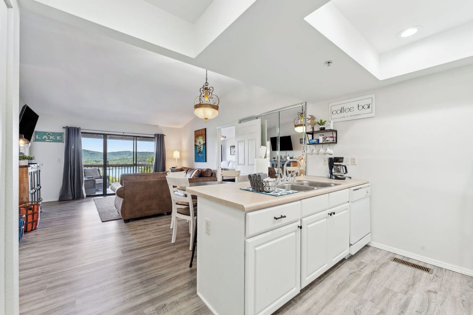 Open layout connecting kitchen, dining, and living spaces