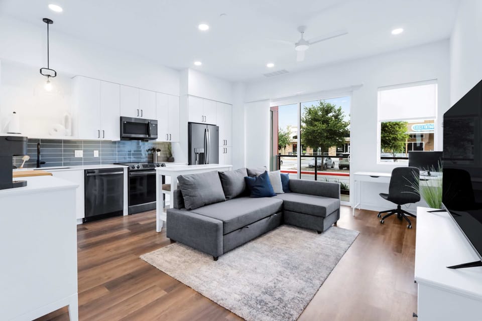 Condo, 1 Queen Bed with Sofa bed, Patio, City View (Poolside Suite) | Living area | 50-inch flat-screen TV with digital channels
