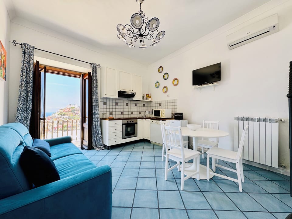 Apartment, Sea View | Private kitchen | Espresso maker, electric kettle, dining tables