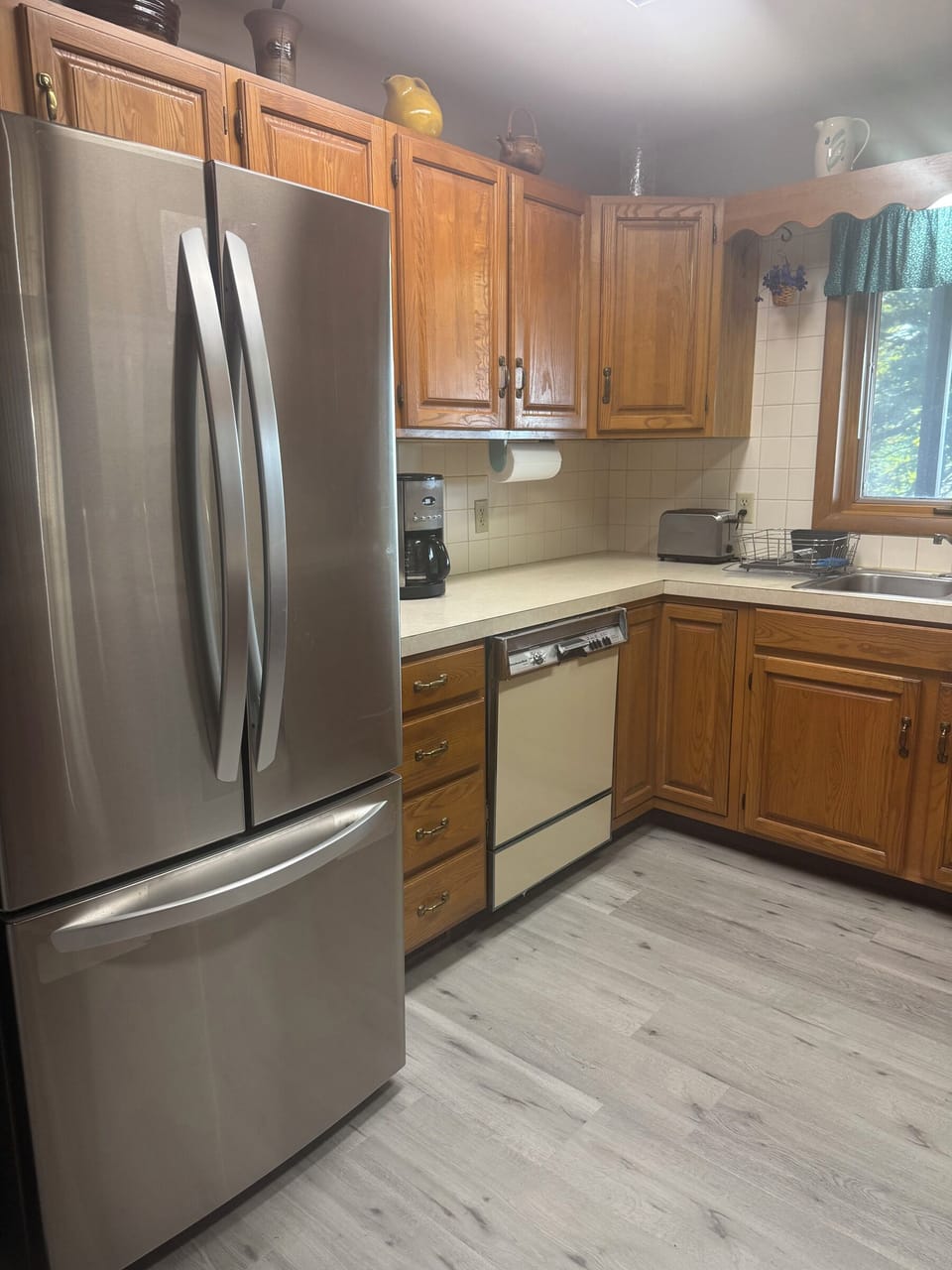 Kitchen with refrigerator, oven, stove, and microwave