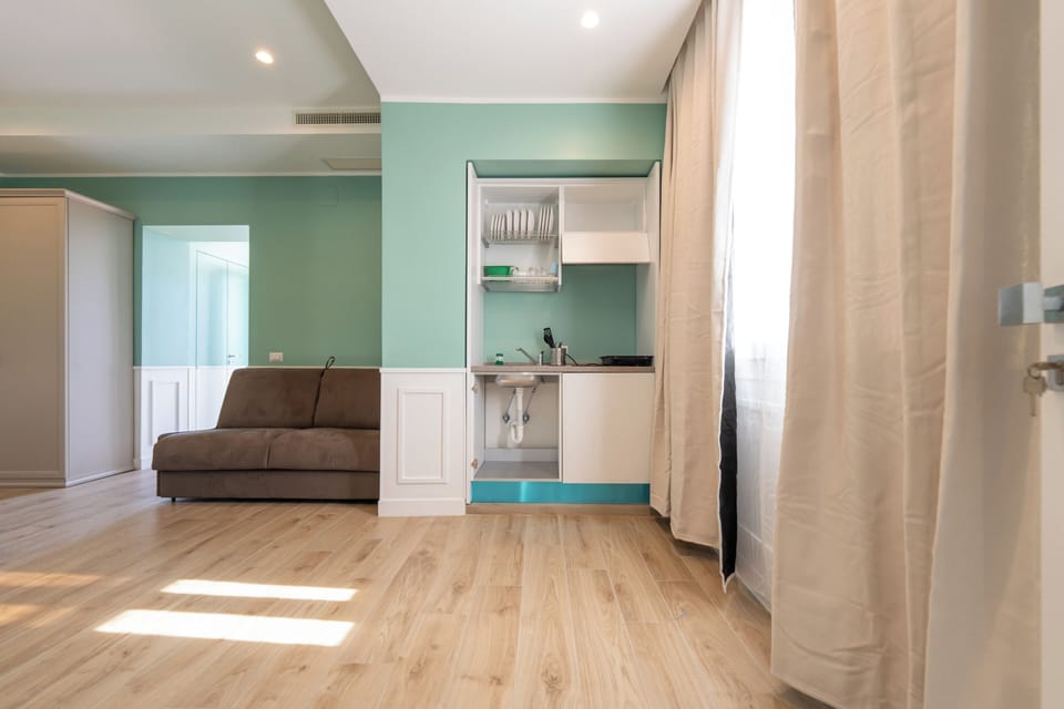 Luxury Quadruple Room, City View | Private kitchen | Mini-fridge, espresso maker, coffee/tea maker, electric kettle