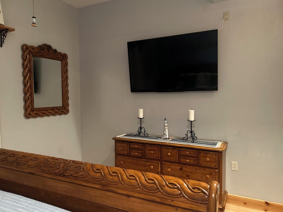 Master bedroom with smart tv.