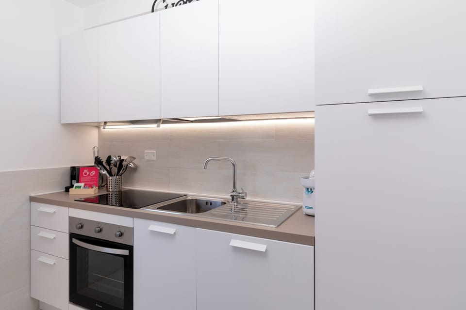 Apartment, Sea View | Private kitchen | Fridge, oven, stovetop, dishwasher
