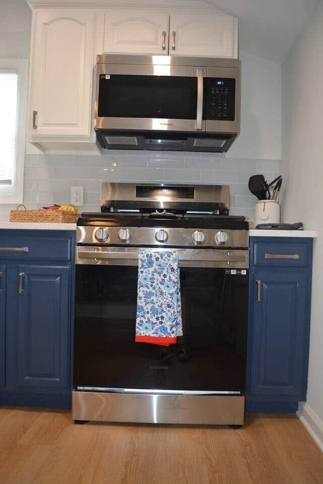 Brand new stainless steel appliances including a microwave, gas stove, dishwasher, & refrigerator.