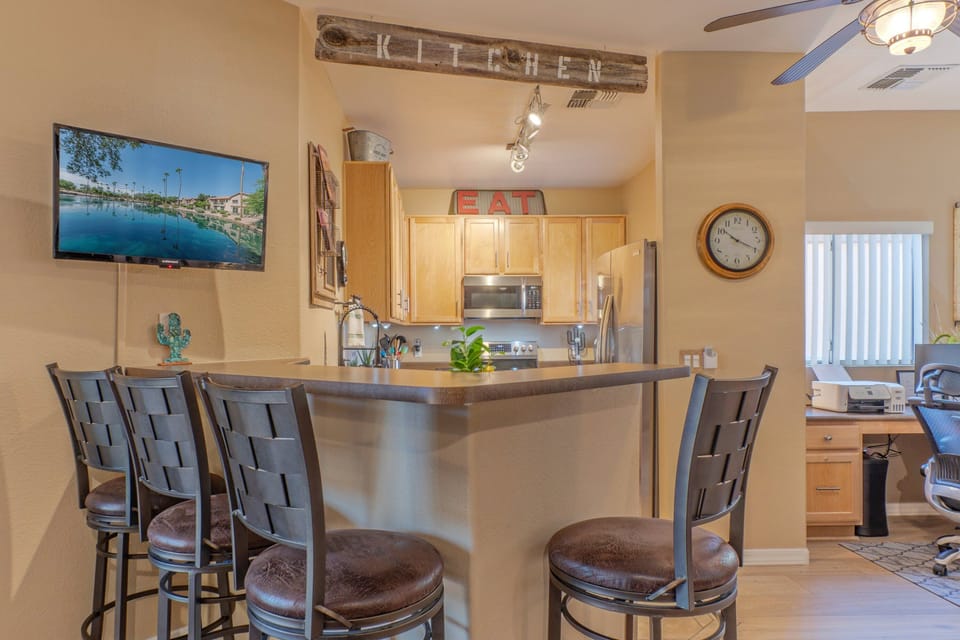 Sip coffee at the kitchen bar while watching the morning news.