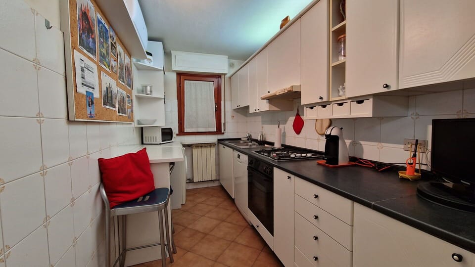 Cozy and fully equipped kitchen, part of a large apartment close to the sea.