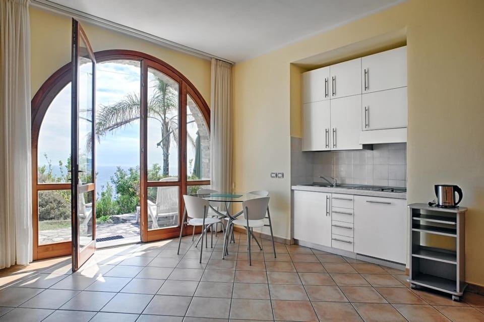 Fridge, stovetop, electric kettle, cookware/dishes/utensils