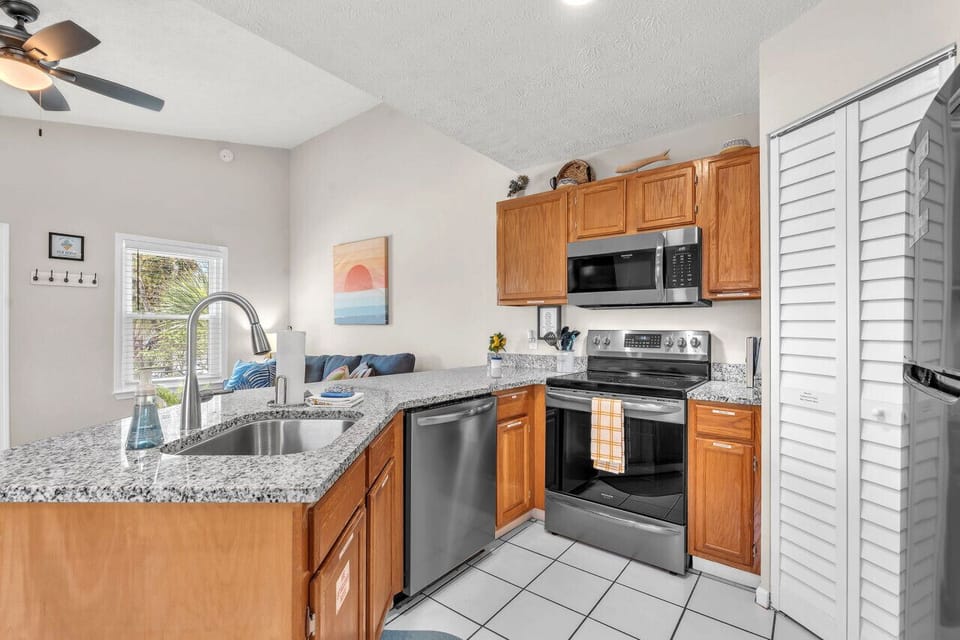 Open and functional kitchen for all your cooking needs! Brand new stainless steel appliances throughout.