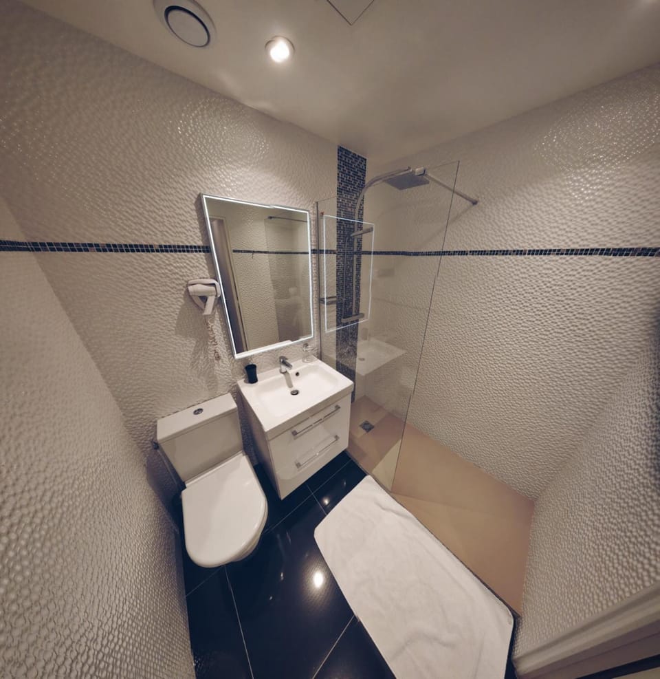 Shower, rainfall showerhead, hair dryer, towels